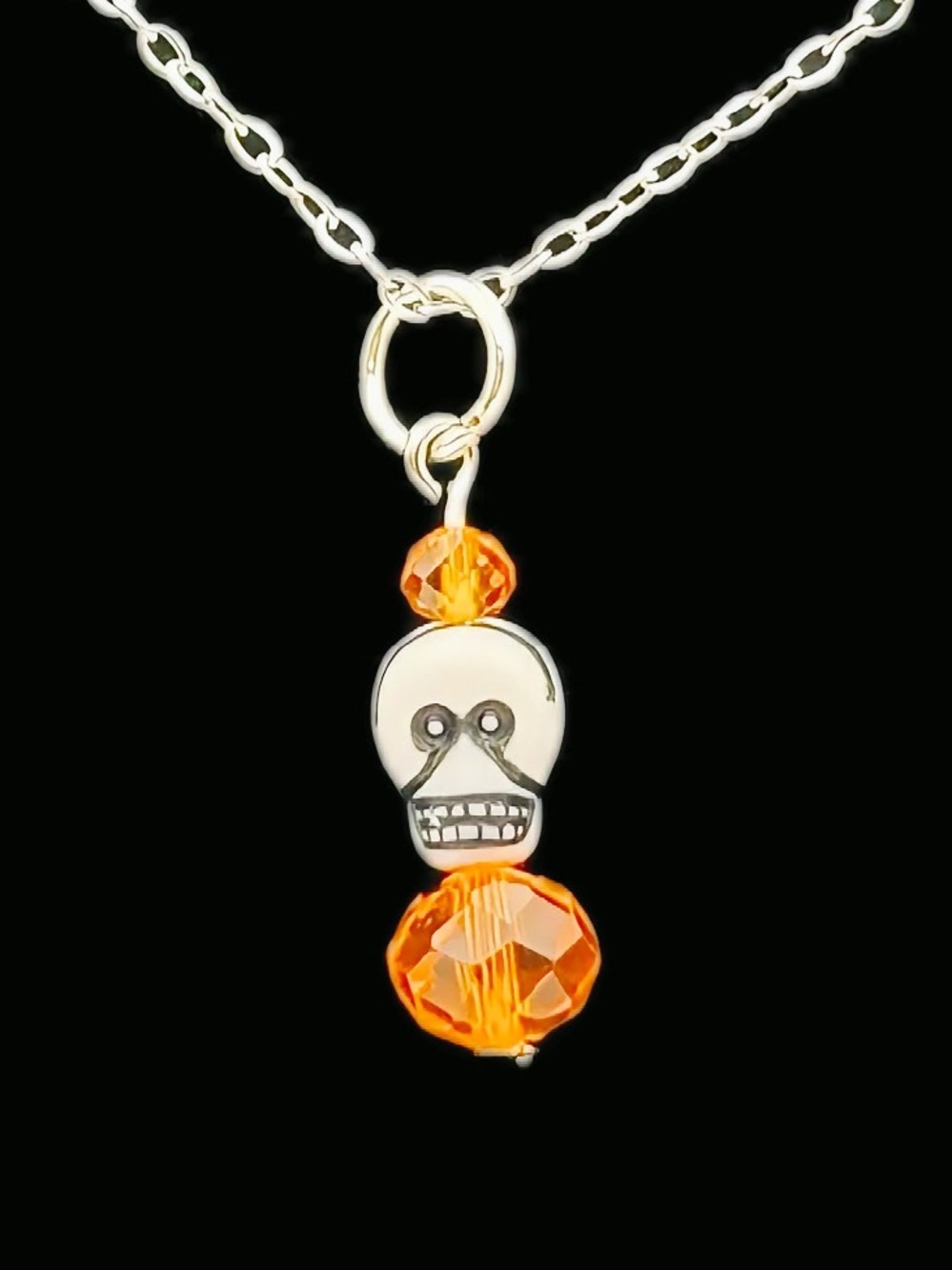 White Skull Pendant Necklace with Orange Crystal Beads on Silver Tone Chain